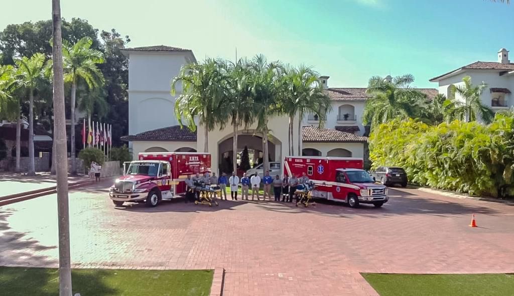 The EMTS team and both ambulances outside the clubhouse at Buenaventura