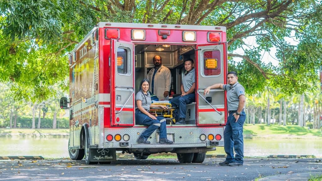 EMTS crew and physician at the rear of an advanced life support unit