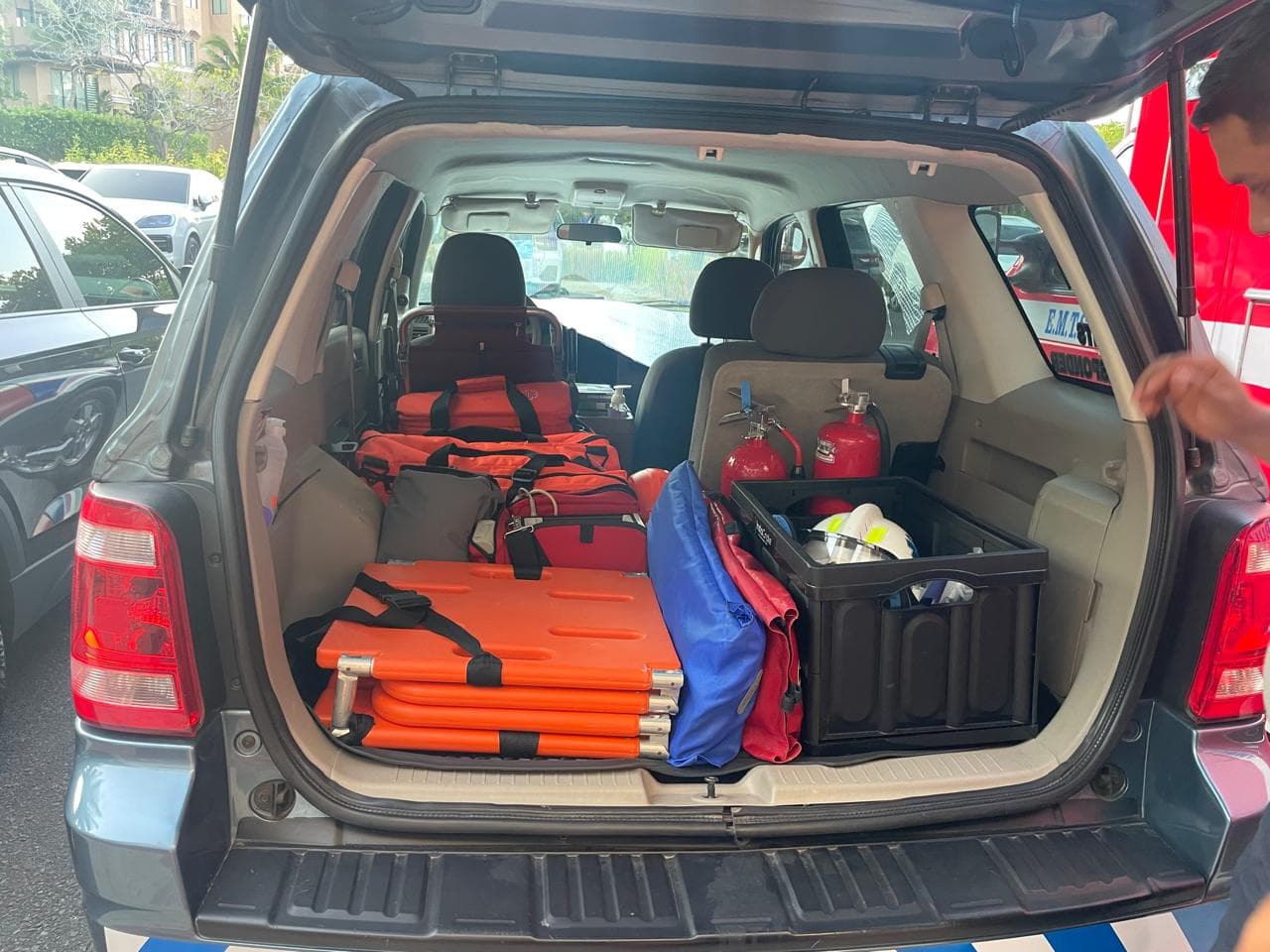 Response bags, backboards, extrication gear, and fire extinguishers loaded in the back of an EMTS quick response vehicle