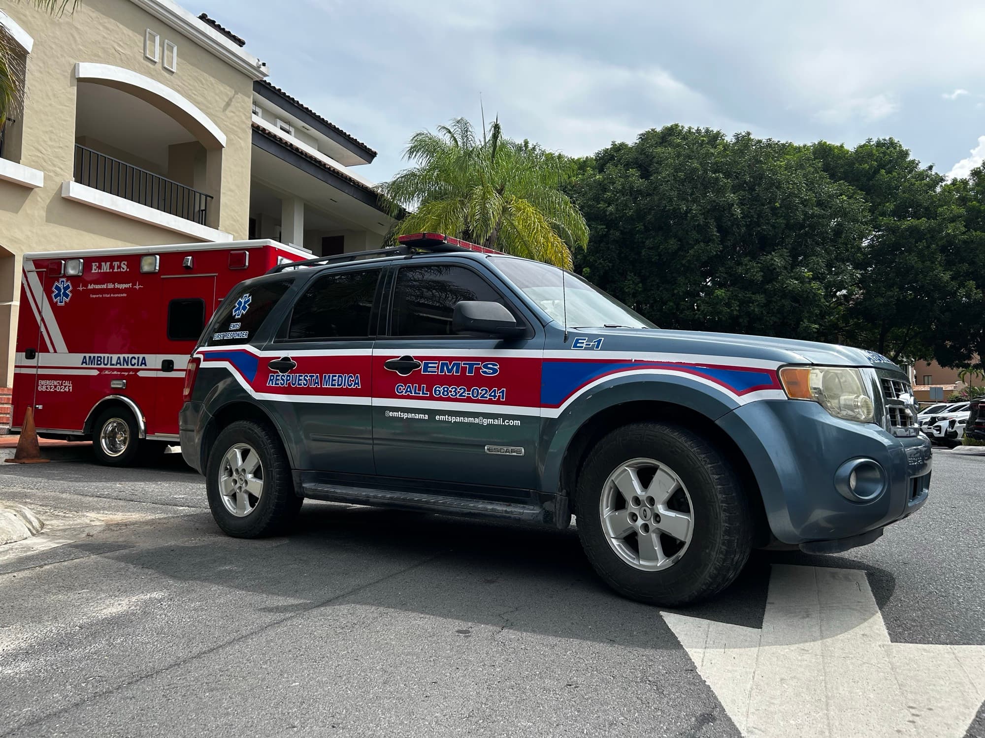 EMTS quick response vehicle E-1 parked alongside an advanced life support ambulance